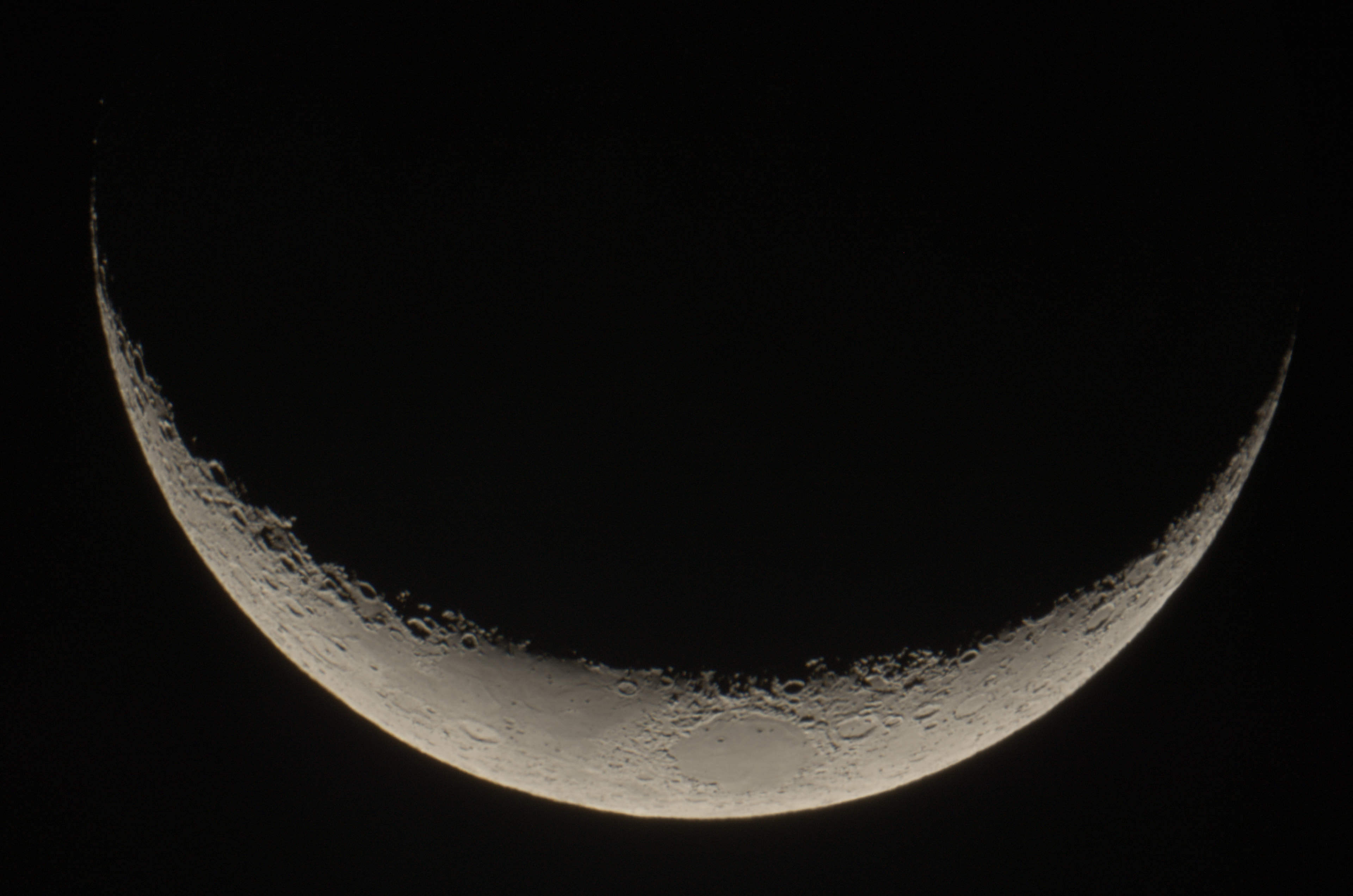Waxing crescent, rotated 90° CW